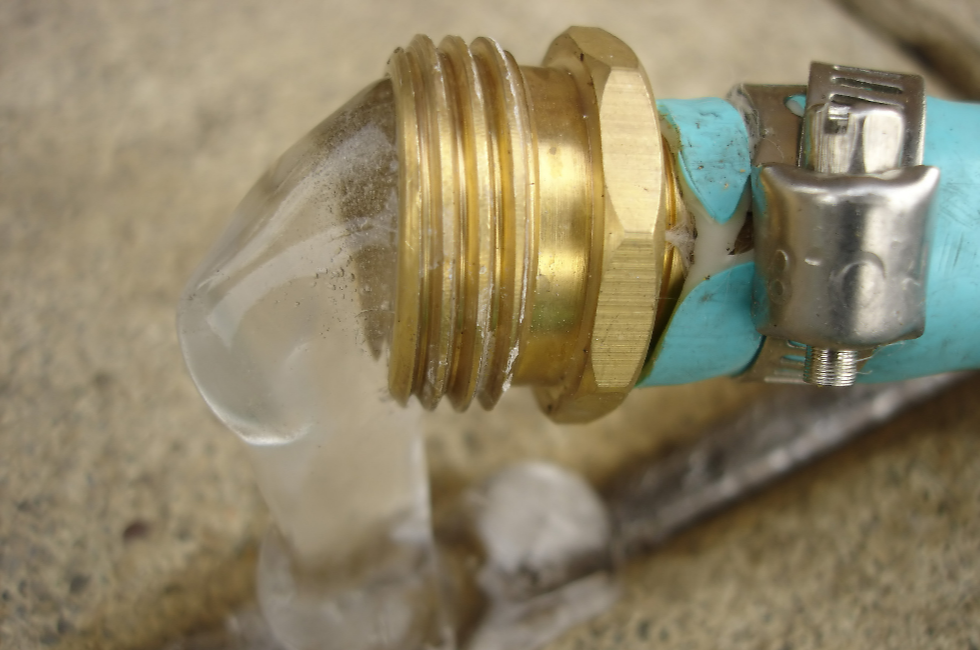 Frozen water coming out of the end of a hose
